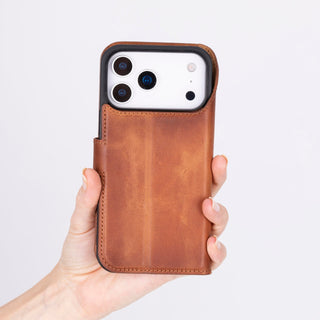 Hand holding an iPhone 18 Pro Max in a Venito Ravenna leather wallet case